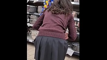 Spying teen girl at supermarket short skirt