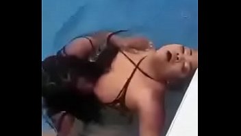 Black girls play with each other in the pool